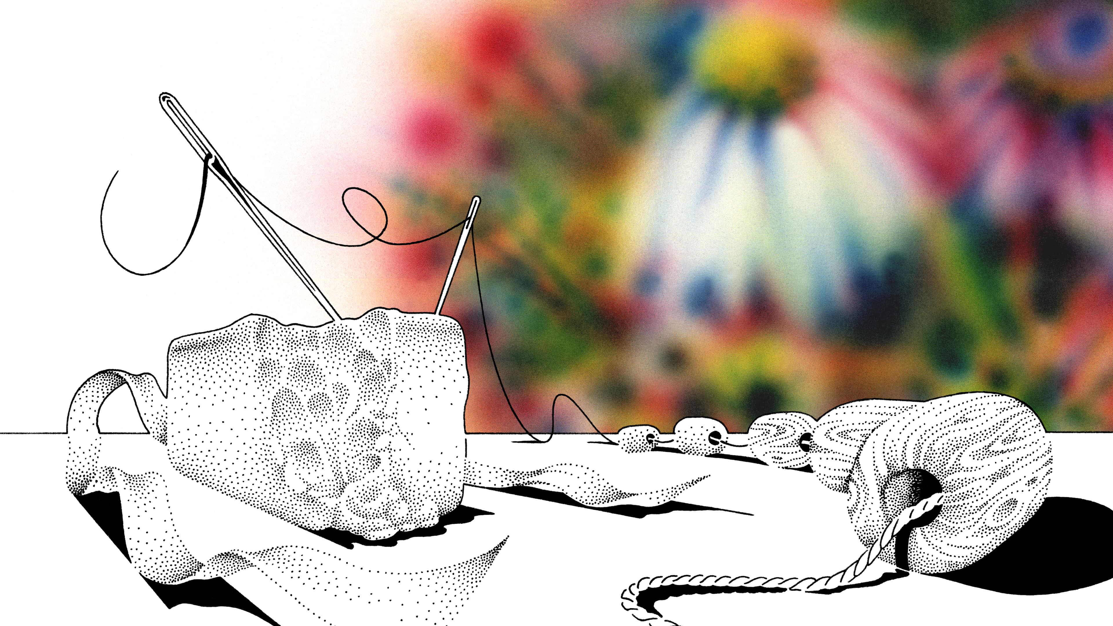 A black and white needle and thread being woven with beads in front of a background of a colorful rainbow of flowers